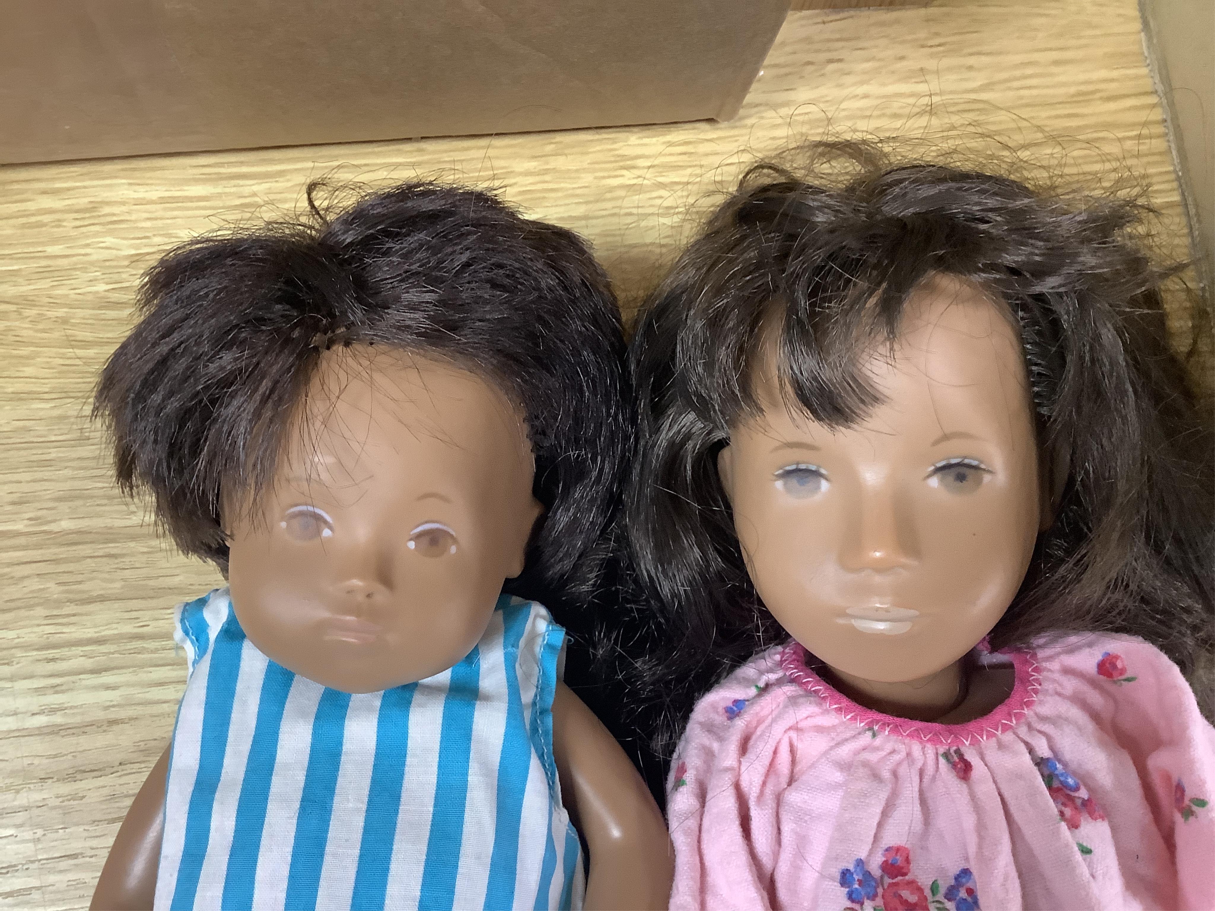 Three Sasha dolls and a quantity of dolls clothing. Condition - good